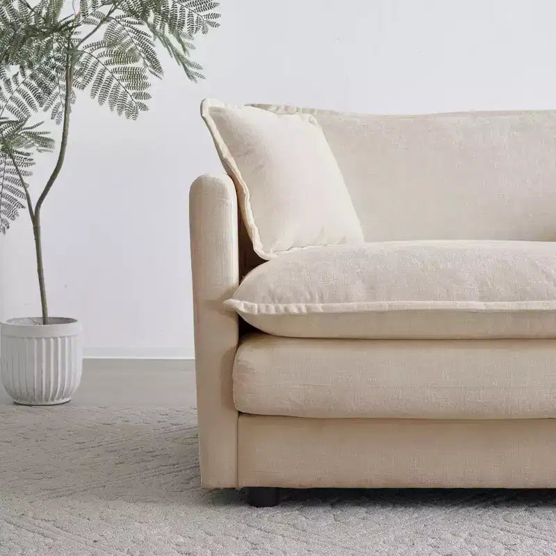 Sillón decorativo tapizado en crema, respaldo de almohada, para 1 persona