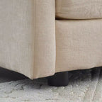 Sillón decorativo tapizado en crema, respaldo de almohada, para 1 persona